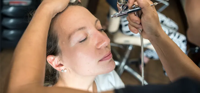 Applying Airbrush Makeup on Face
