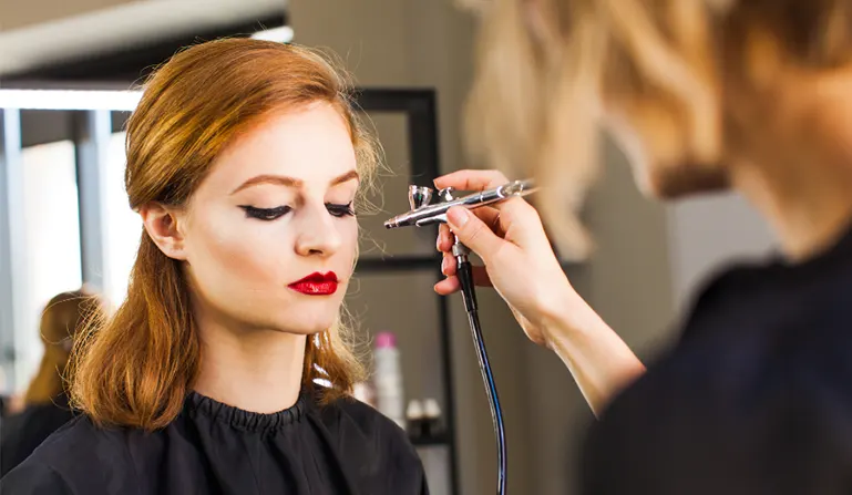 Applying airbrush makeup for combination skin