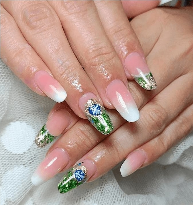 Pink and white ombre nails with glitter